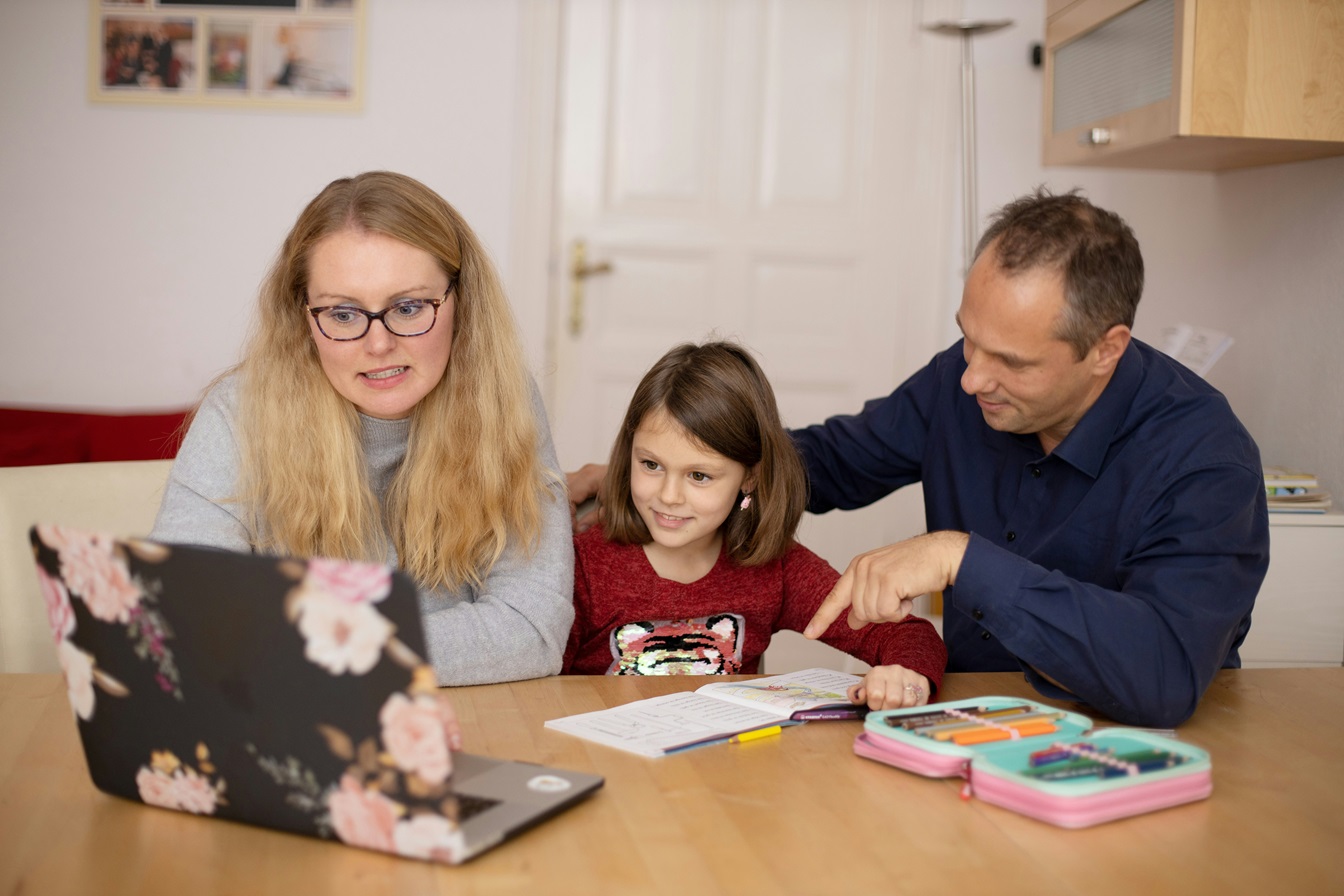 student and parent looking at tutor management software interface on PC